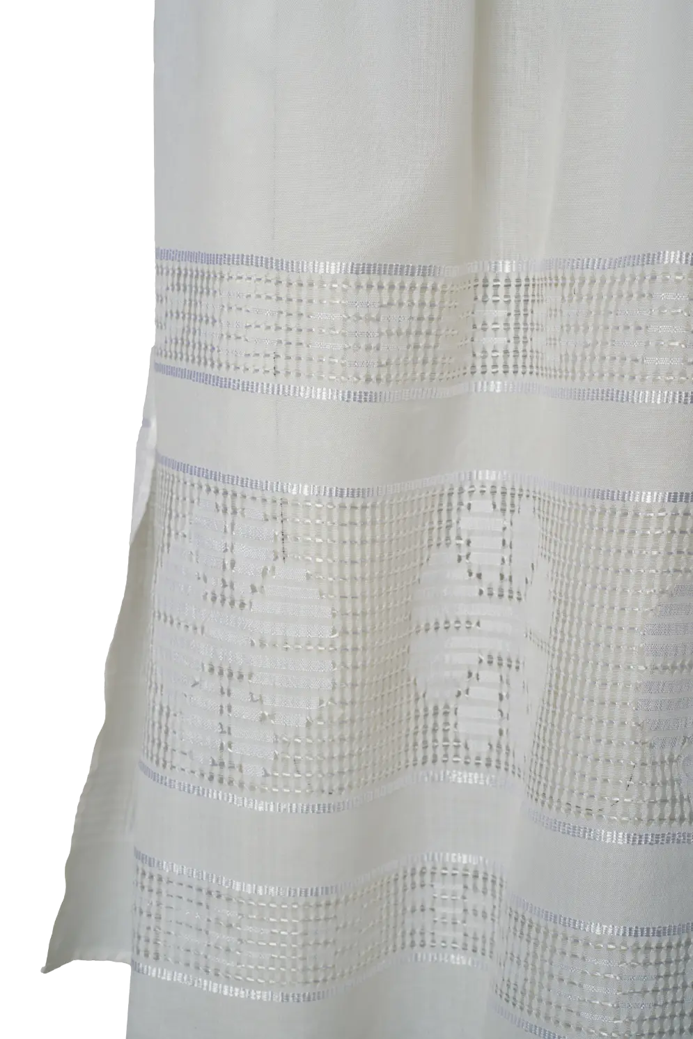 Close-up of a white fabric with textured pattern on a white background