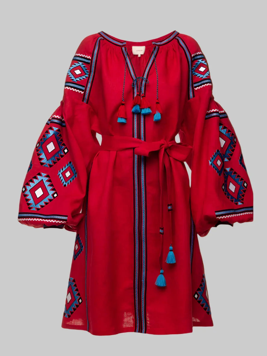 Red dress with blue and white patterns on a gray background