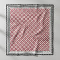 Red and white geometric patterned product with black border on a white background
