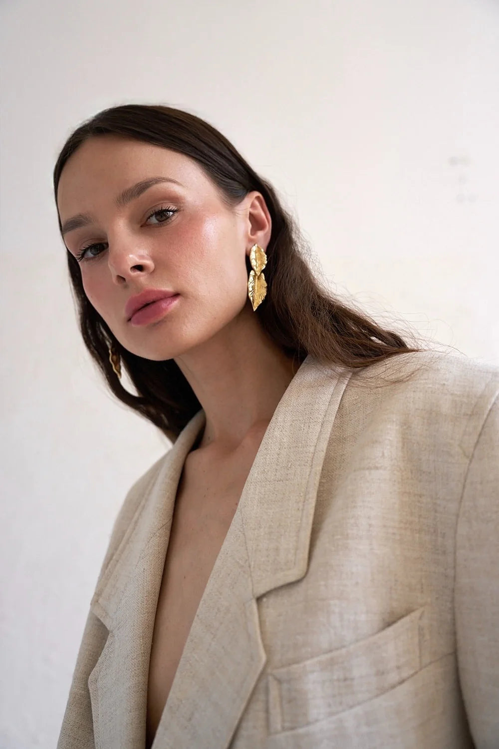 Gold leaf-shaped earrings