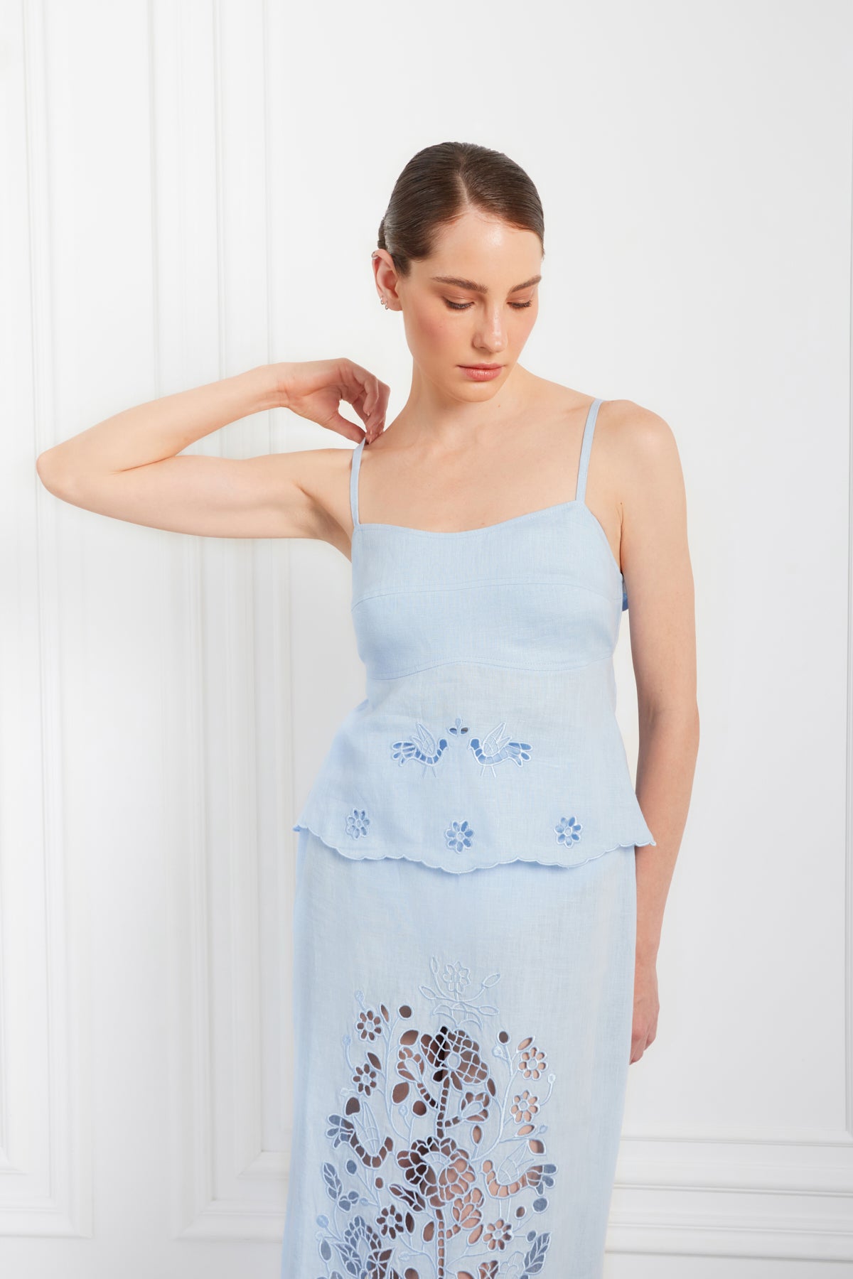 Woman wearing a light blueRichelieu cutowork dress blouse roumaine shop