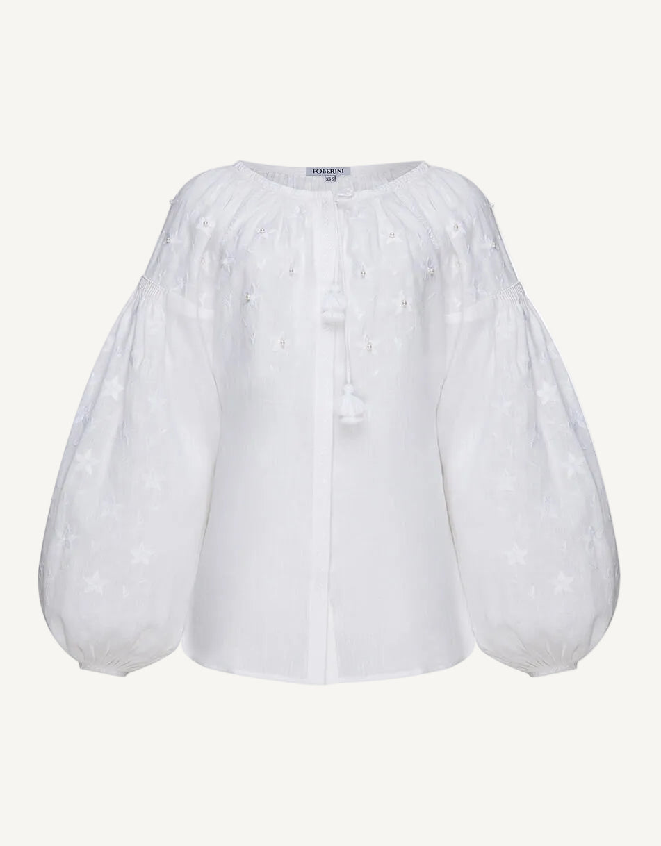 White blouse with puff sleeves with pearls