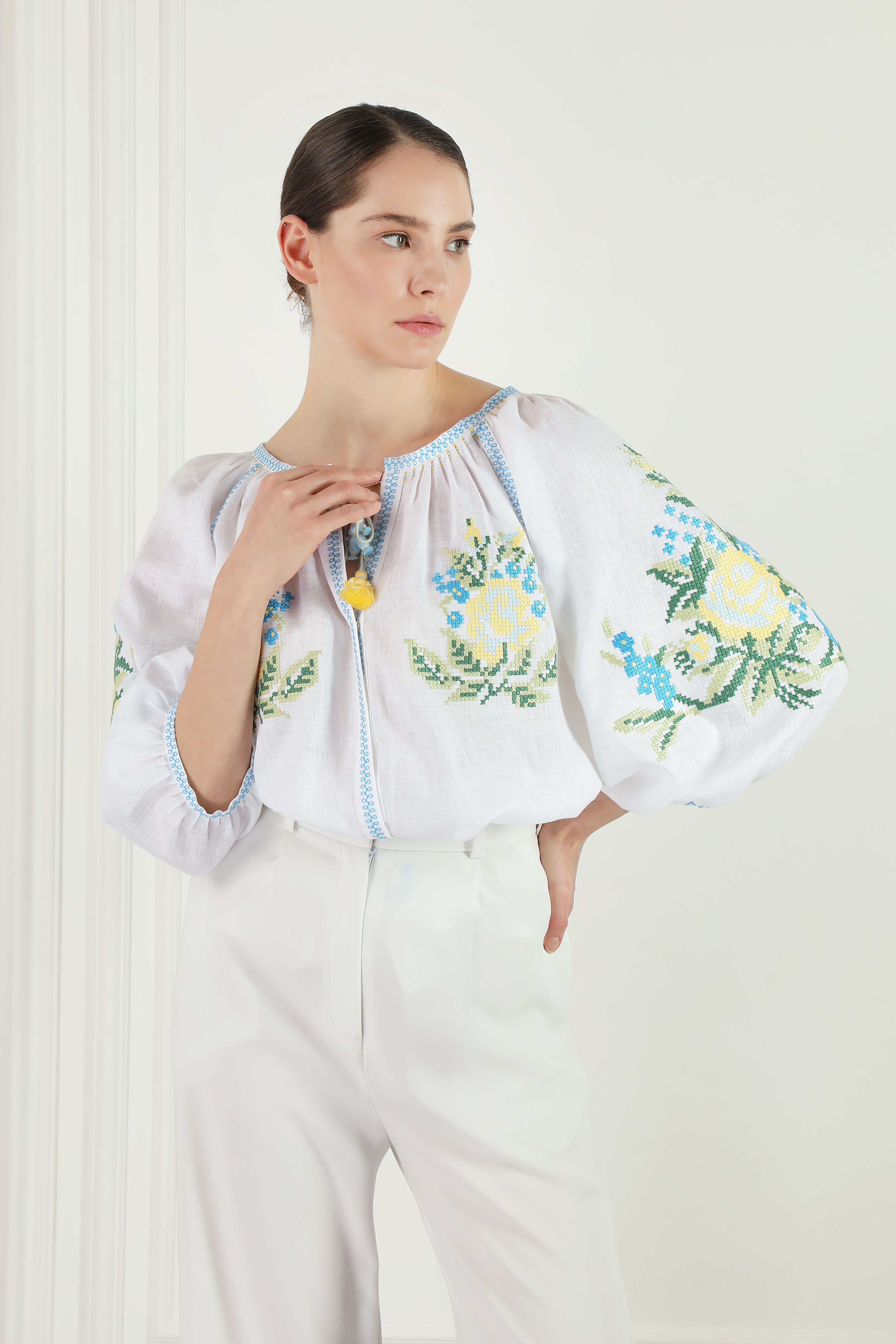 Embroidered white linen blouse with floral cross-stitch Evelyn