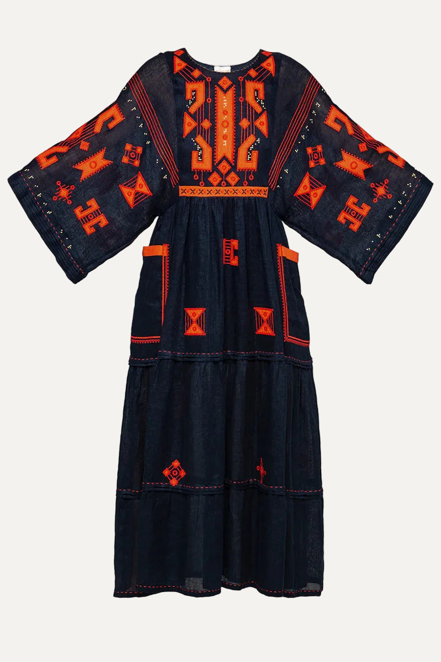 Black dress with orange geometric patterns on a white background
