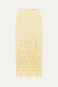 Yellow lace skirt with floral embroidery on a white background