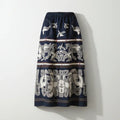 Navy blue skirt with white floral pattern on a white background