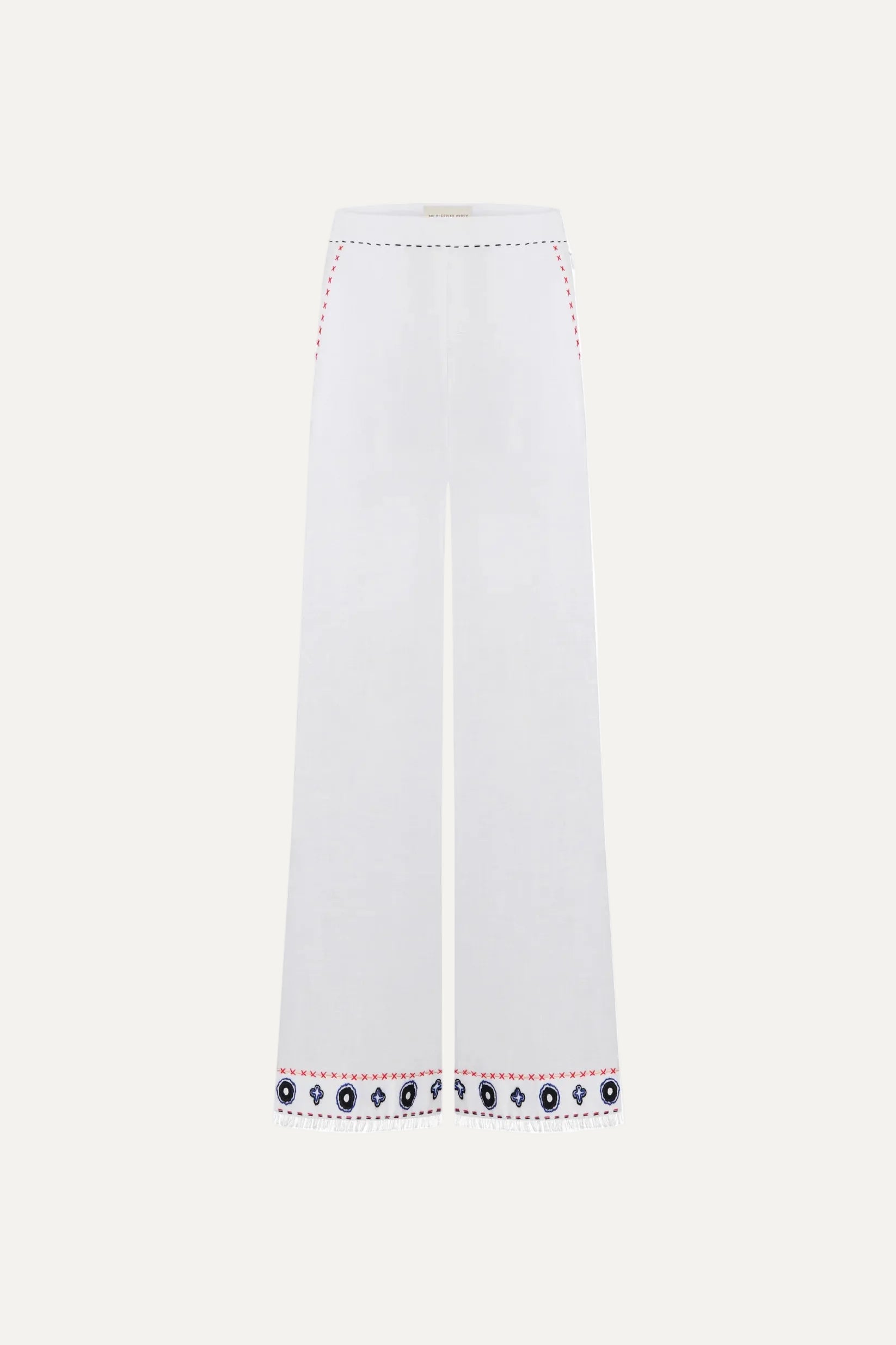 White pants with decorative hem embroidery
