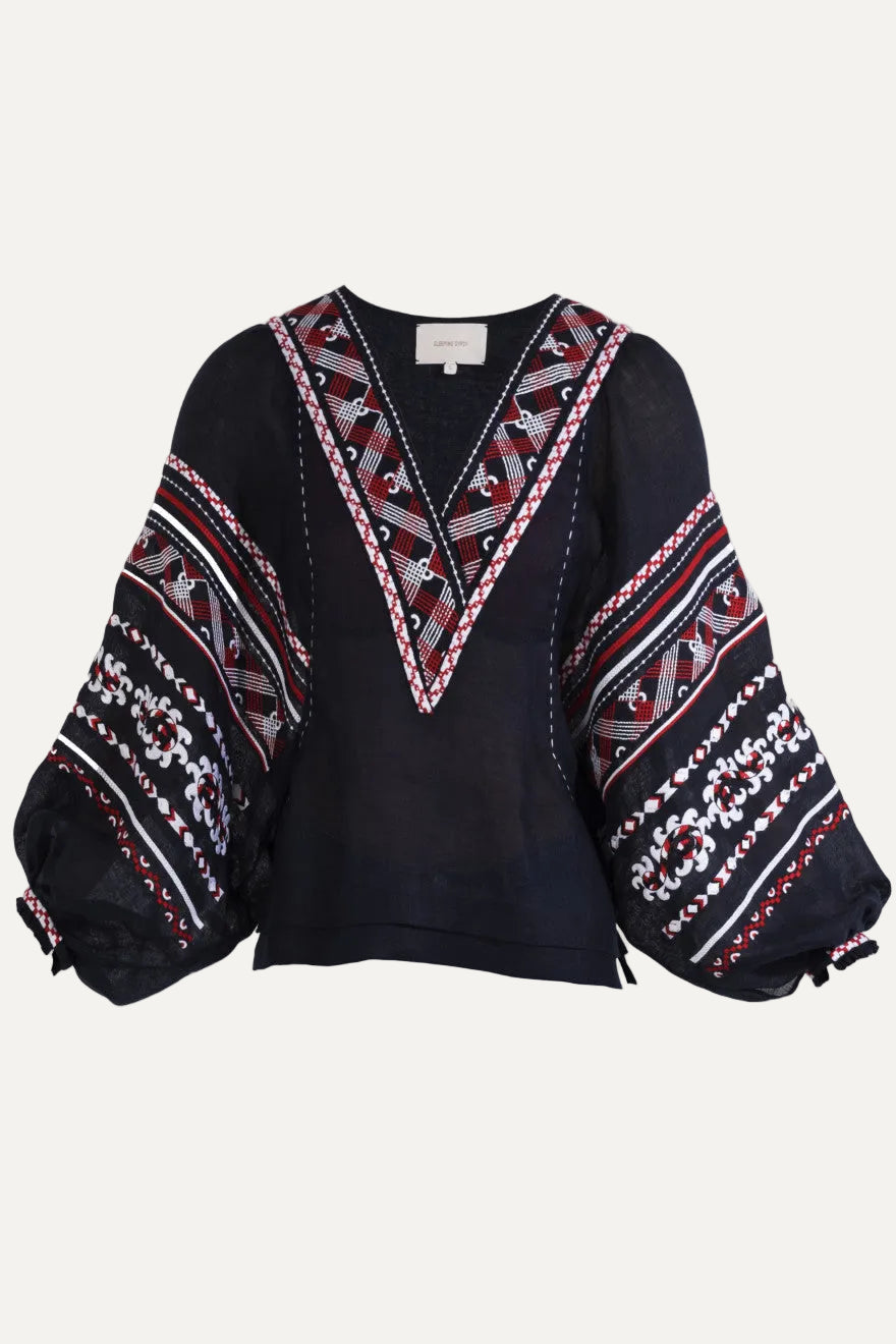Black blouse with colorful geometric patterns on a white background