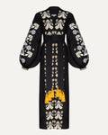 Black dress with white floral embroidery and yellow accents on a white background