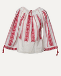 White blouse with red embroidery on a light gray background