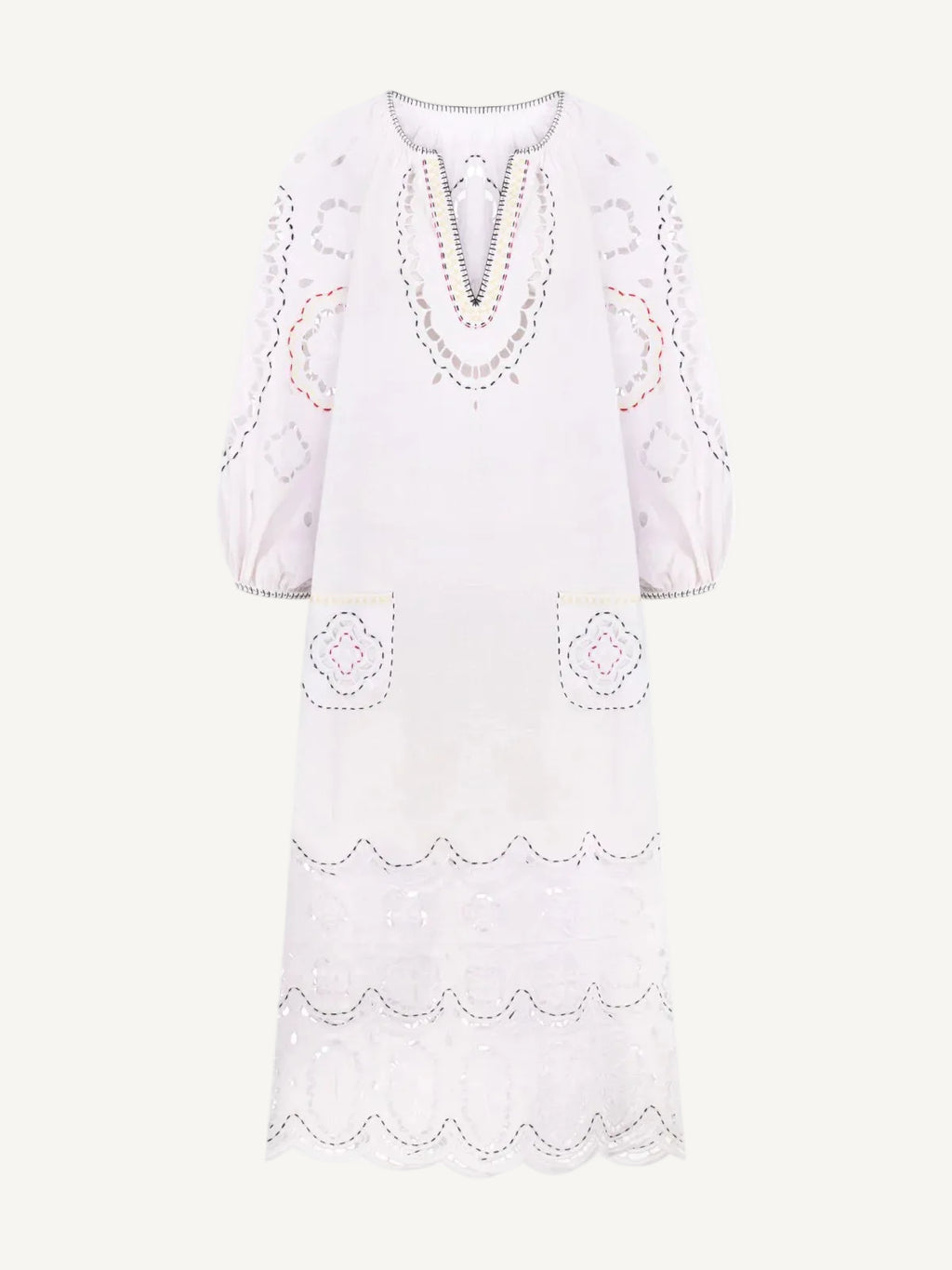 White dress with decorative embroidery on a white background