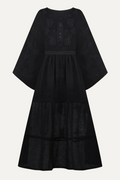 Black dress with smocked details on a light gray background