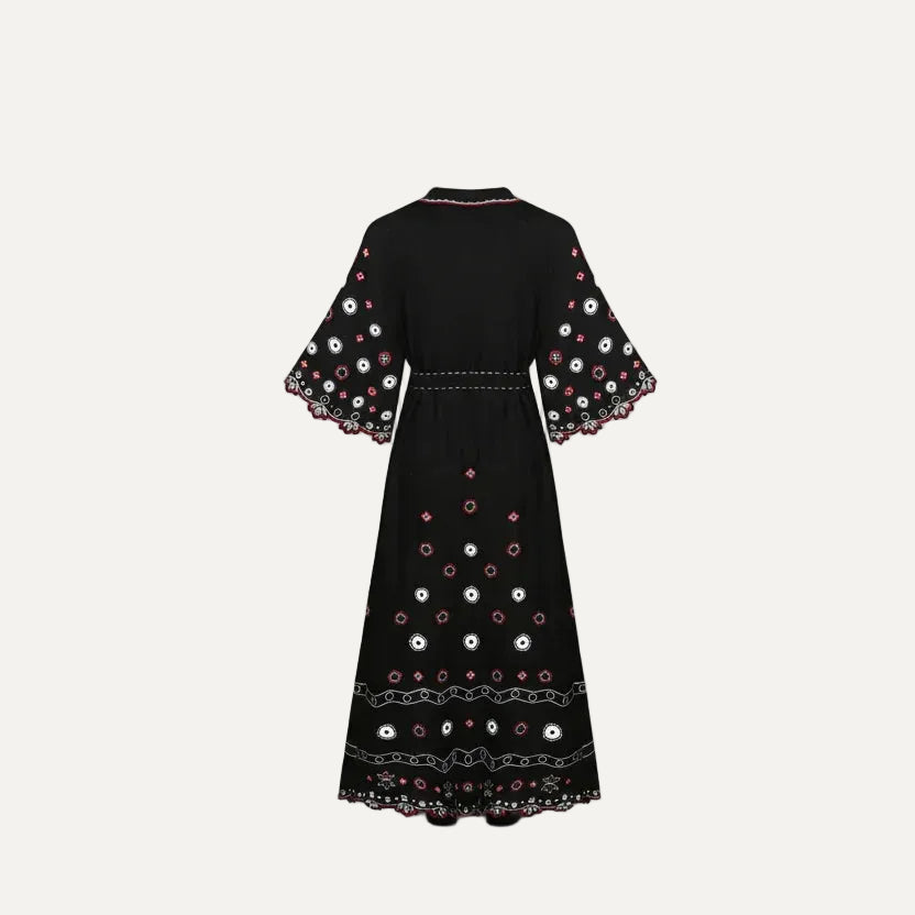 Black dress with colorful embroidery on a white background