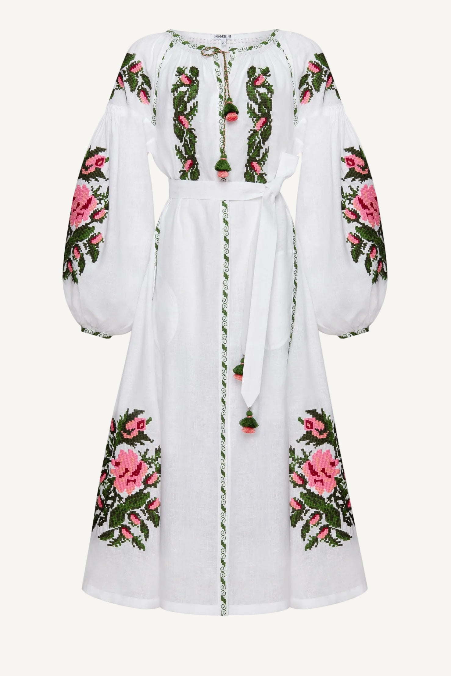 White dress with floral embroidery on a white background