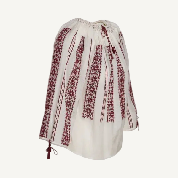 White blouse with red embroidery on a light gray background