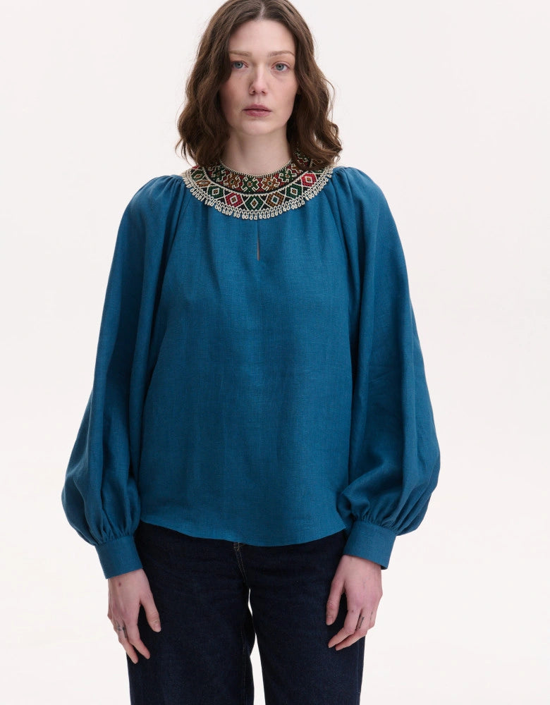 Bohemian linen blouse styled with jeans — Ukrainian heritage