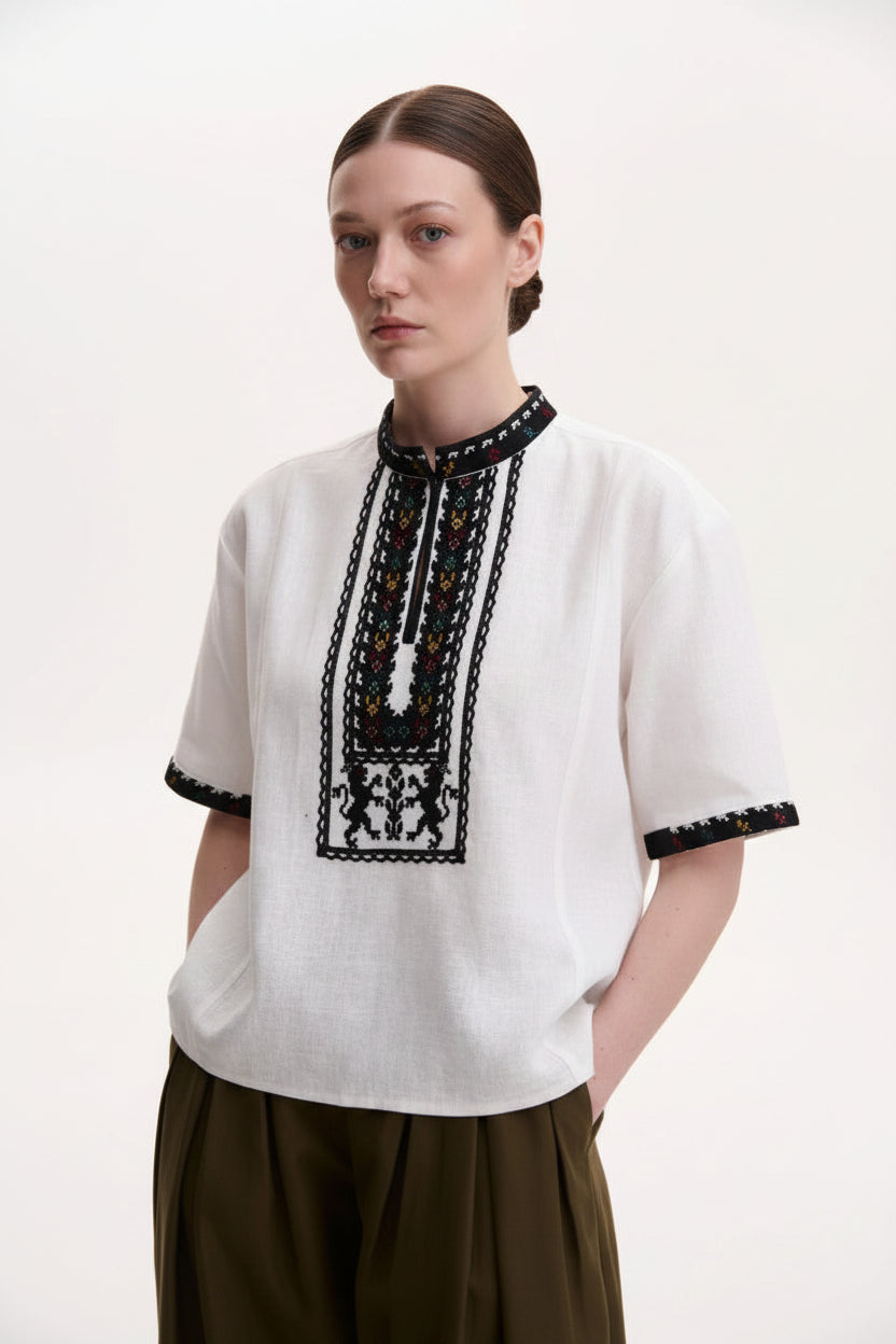 Blouse Roumaine Shop - Vyshyvnka Embroidered Collection, traditional short-sleeve blouse with black embroidered trim around the neckline and sleeve cuffs Vyshyvanka Embroidered Blouse