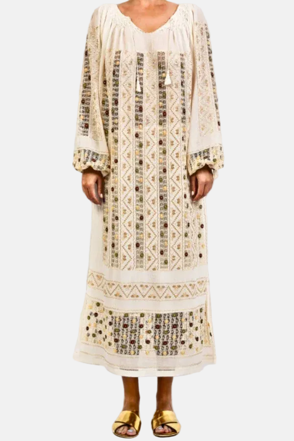 Long, patterned dress worn by a person on a white background