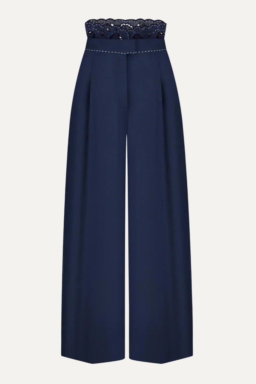 Navy blue pants with lace waistband on a white background