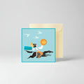Greeting card with a person riding a horse and holding a lion head, with a beige envelope.