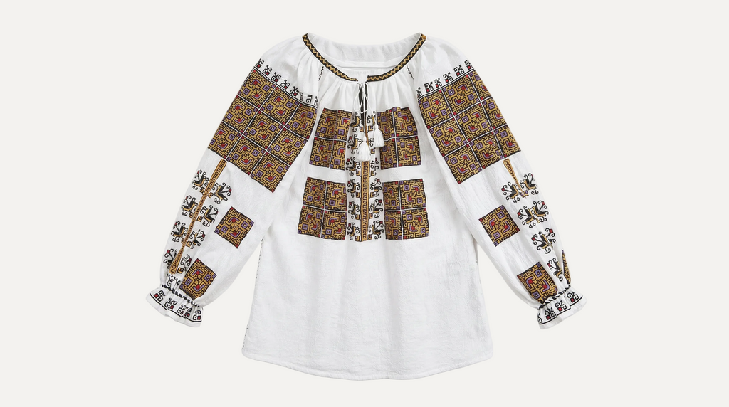 Traditional embroidered blouse on a white background