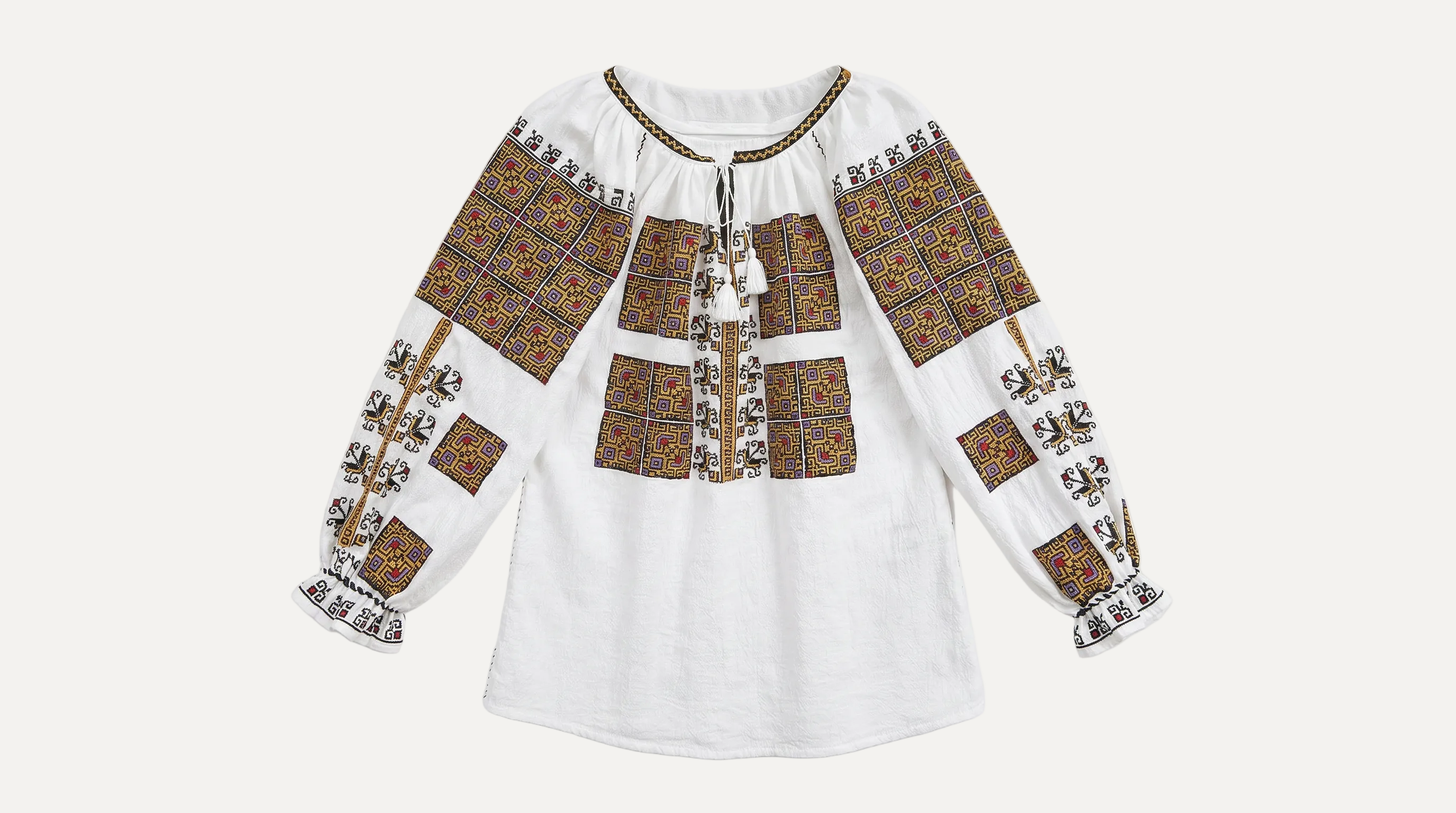 Traditional embroidered blouse on a white background