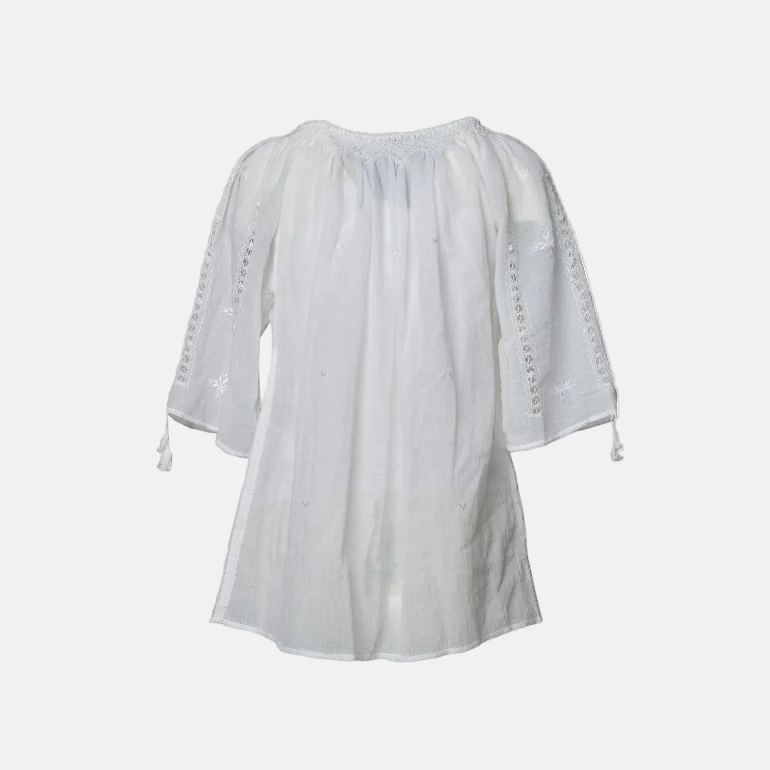 White blouse with lace details on a white background