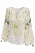 White blouse with yellow embroidery and green tassels on a white background