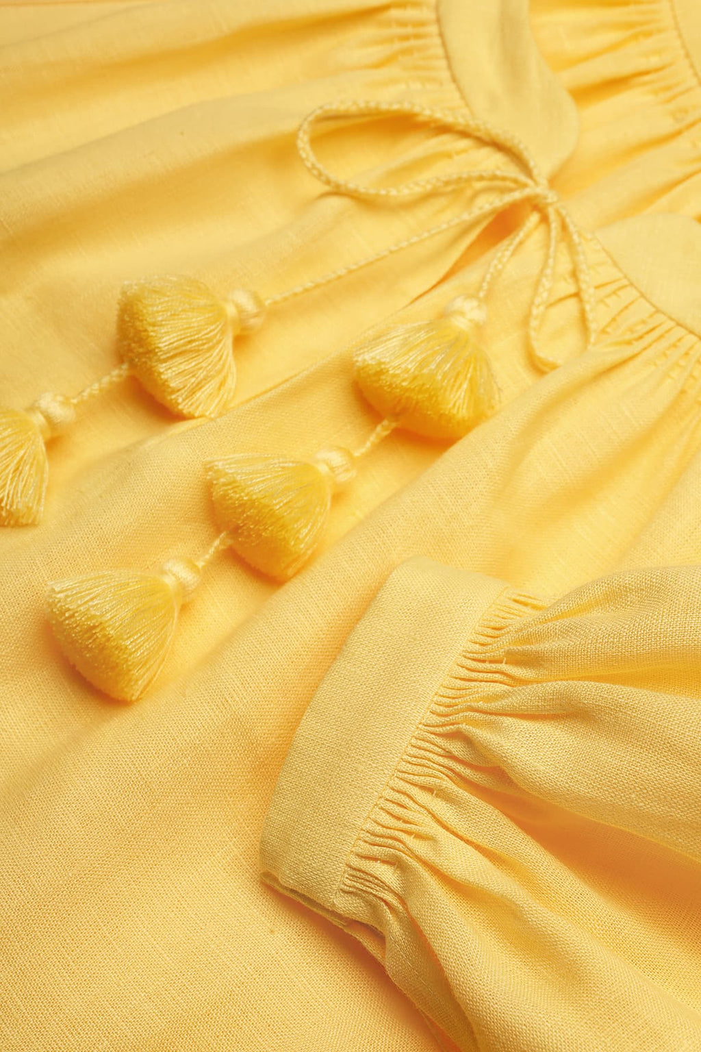 Yellow Foberini linen dress with tassel detail