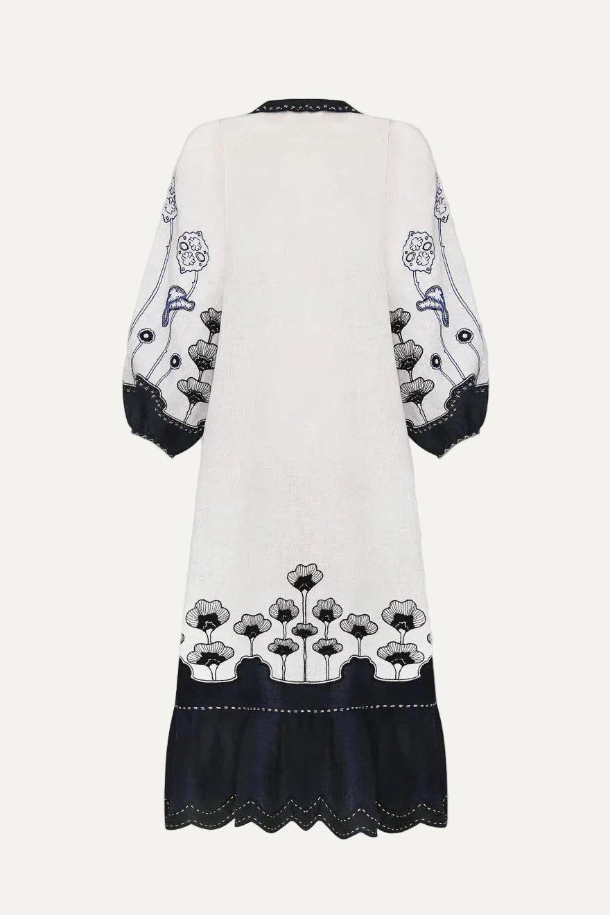 White dress with black floral embroidery on a white background