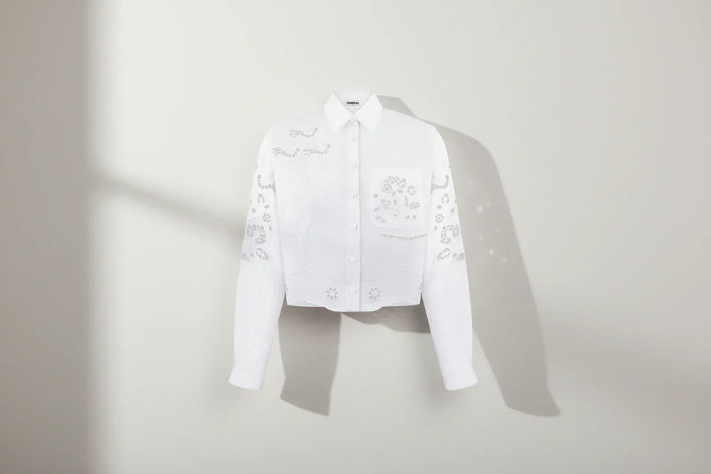 White shirt with floral embroidery on a white background